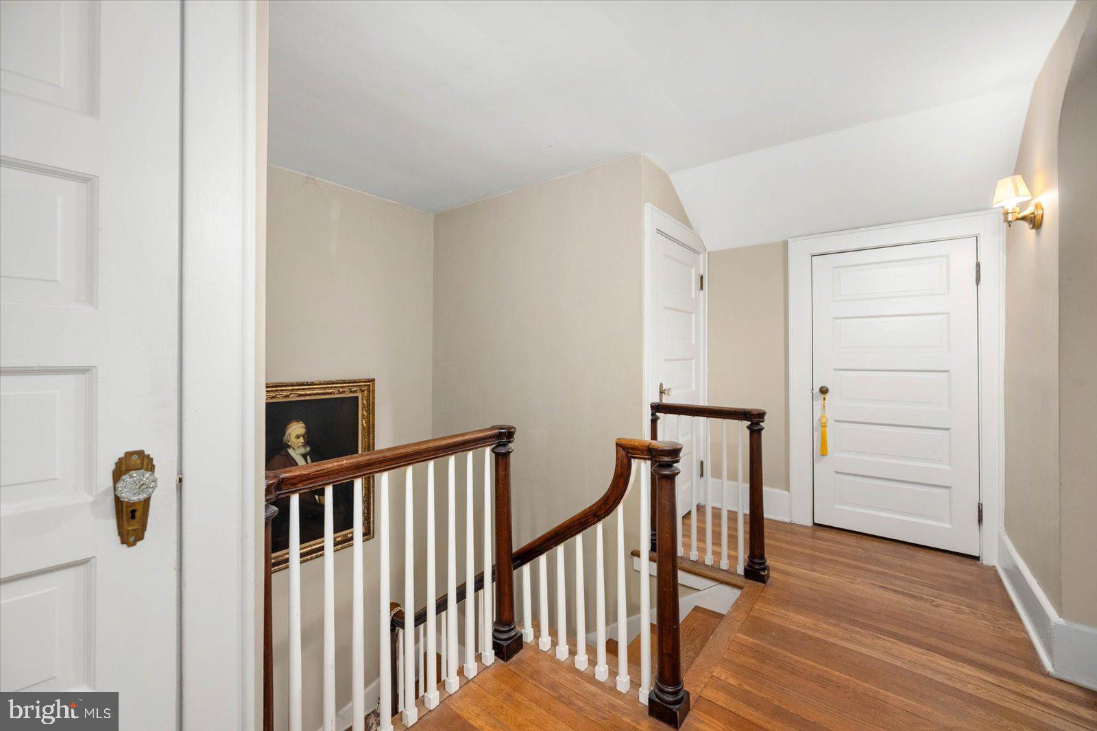 4 Washington Street Berlin, MD 21811 - Photo 25 of 125 a view of a hallway with wooden floor and staircase