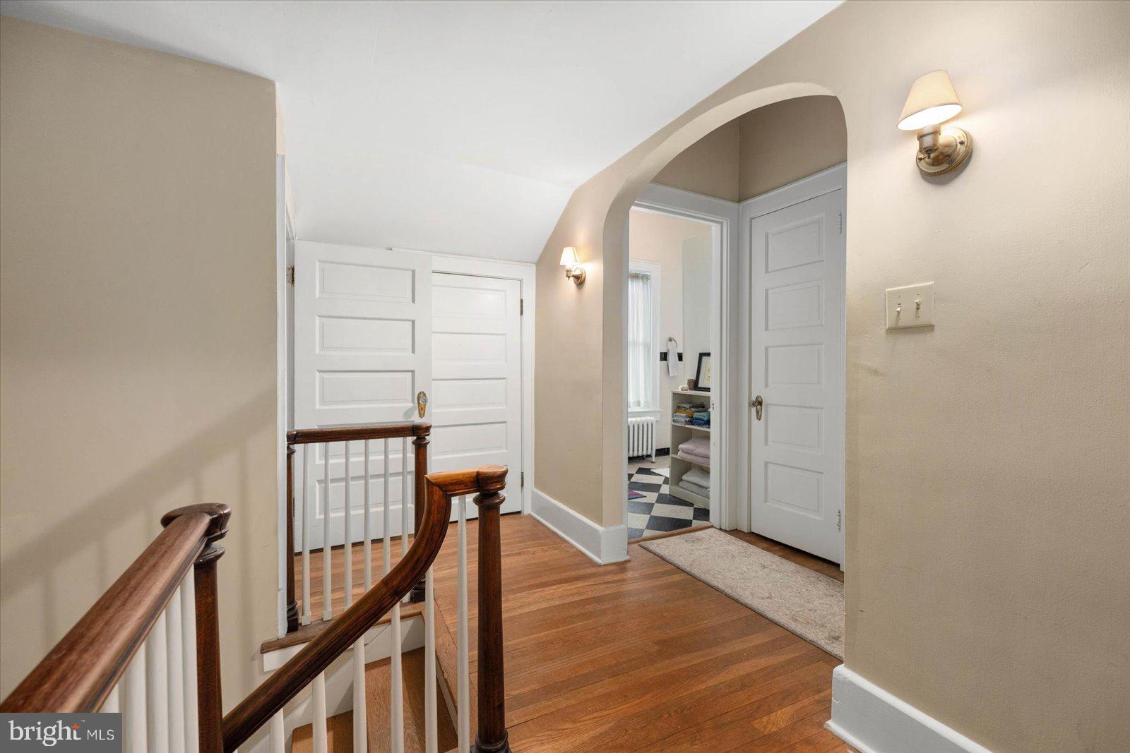 4 Washington Street Berlin, MD 21811 - Photo 27 of 125 a view of a hallway with wooden floor and staircase