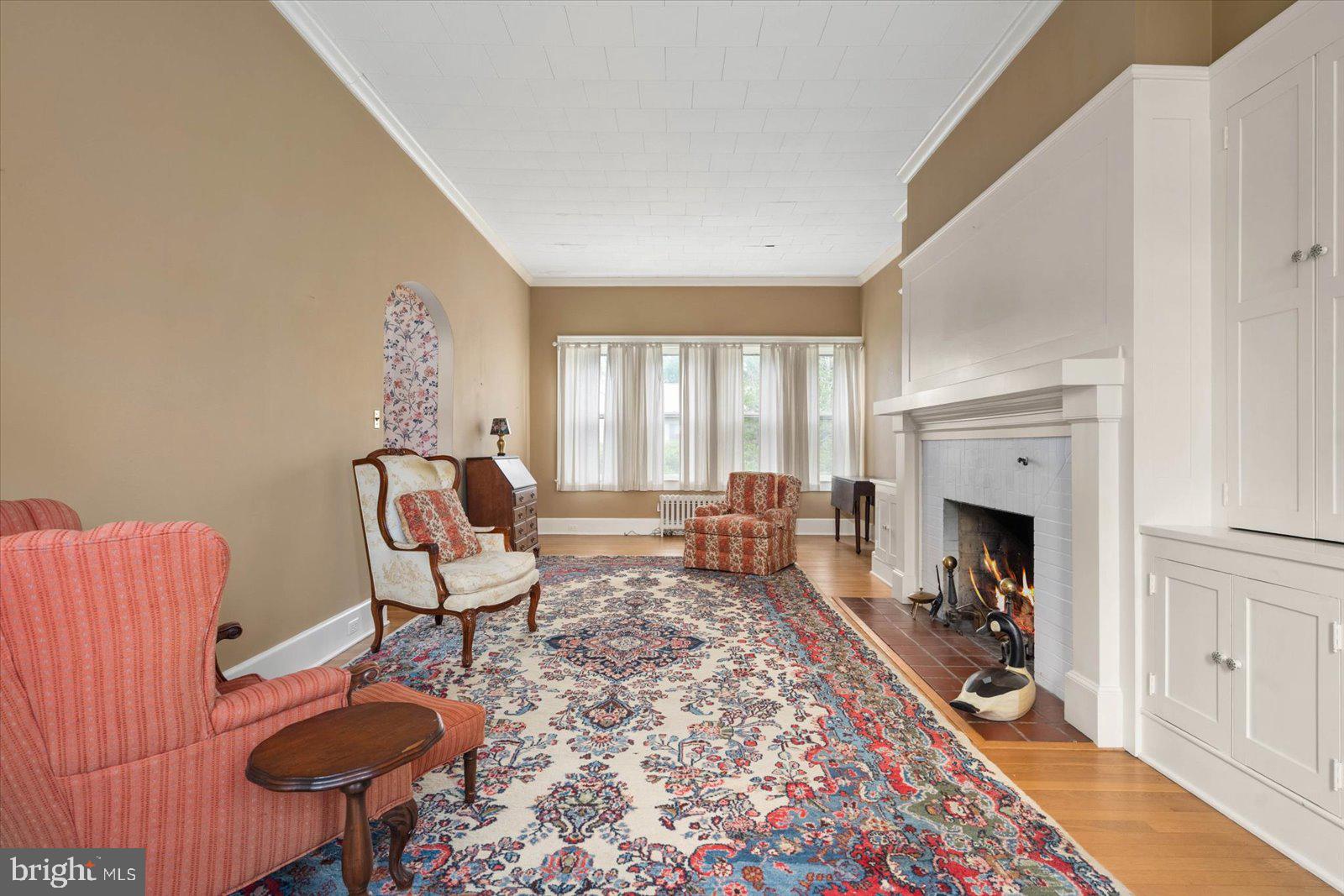 4 Washington Street Berlin, MD 21811 - Photo 65 of 125 a living room with furniture a fireplace and a large window