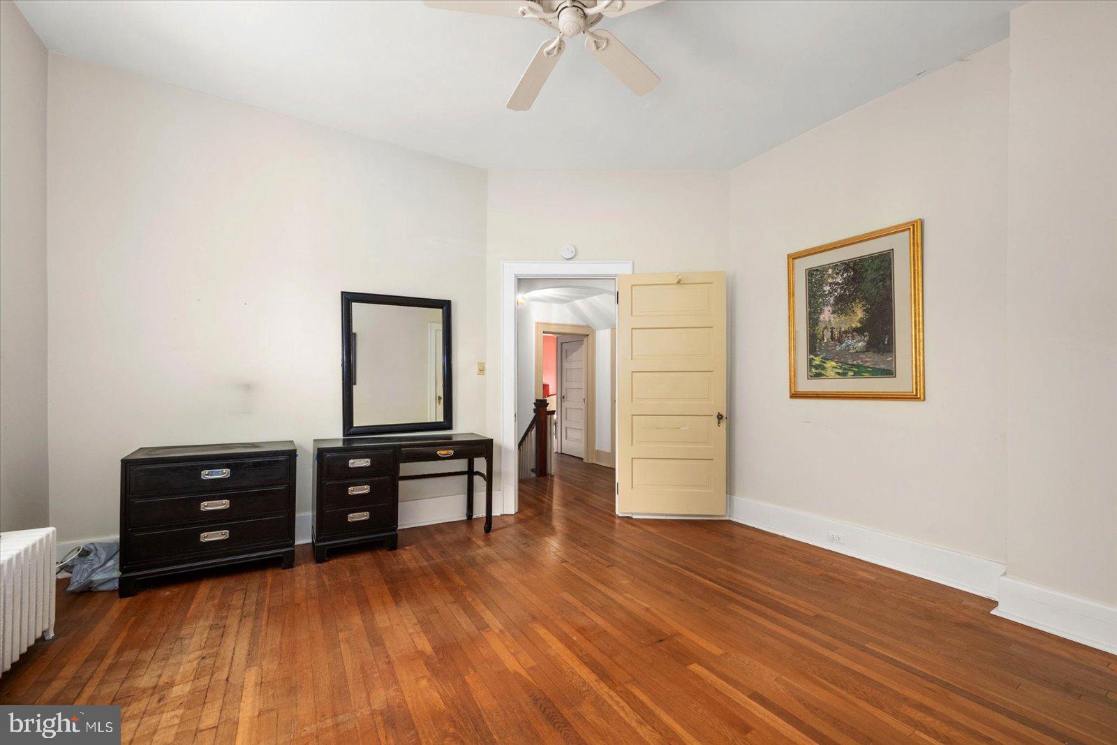 4 Washington Street Berlin, MD 21811 - Photo 73 of 125 a view of a workspace with furniture and wooden floor