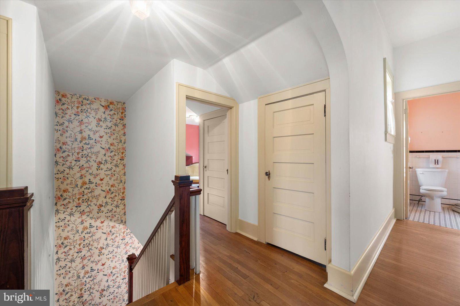 4 Washington Street Berlin, MD 21811 - Photo 74 of 125 a view of a hallway with wooden floor and staircase