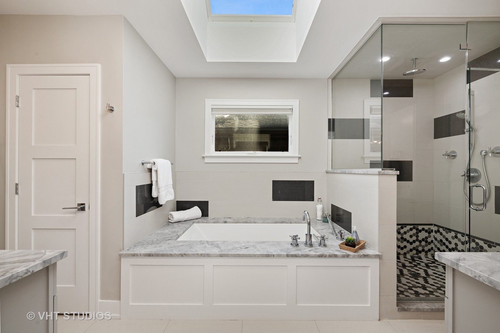 1734 West Henderson Street Chicago, IL 60657 - Photo 11 of 24 a bathroom with a granite countertop sink a large mirror and shower