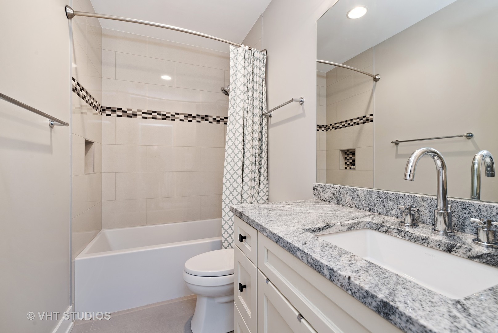 1734 West Henderson Street Chicago, IL 60657 - Photo 14 of 24 a bathroom with a granite countertop sink a toilet and shower
