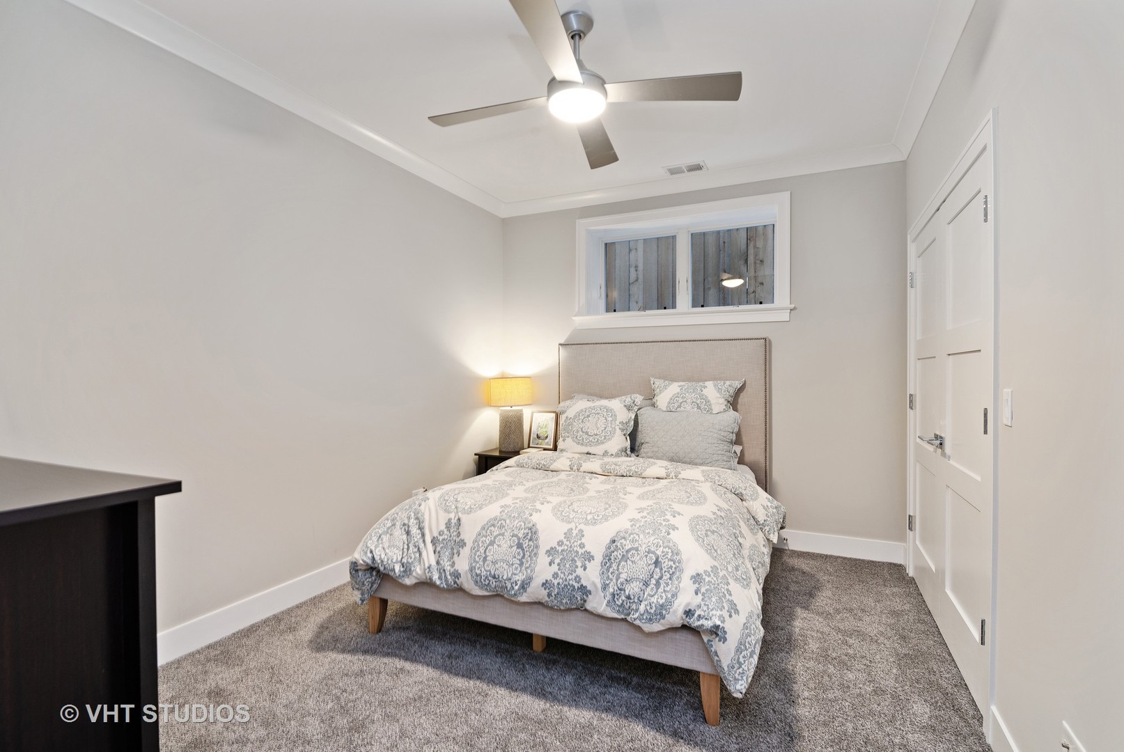 1734 West Henderson Street Chicago, IL 60657 - Photo 17 of 24 a bedroom with a bed and window