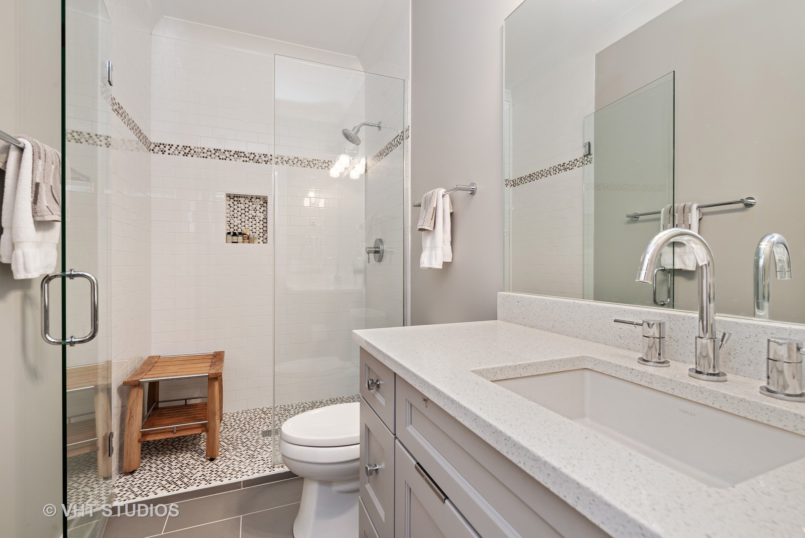 1734 West Henderson Street Chicago, IL 60657 - Photo 18 of 24 a bathroom with a sink toilet and shower