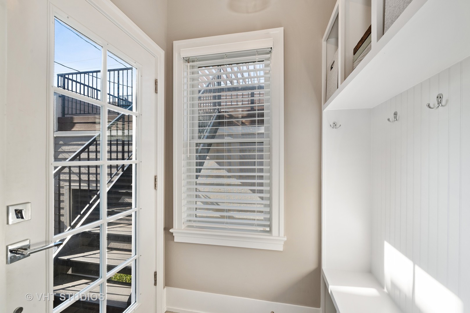1734 West Henderson Street Chicago, IL 60657 - Photo 21 of 24 a view of entry way with wooden floor and windows
