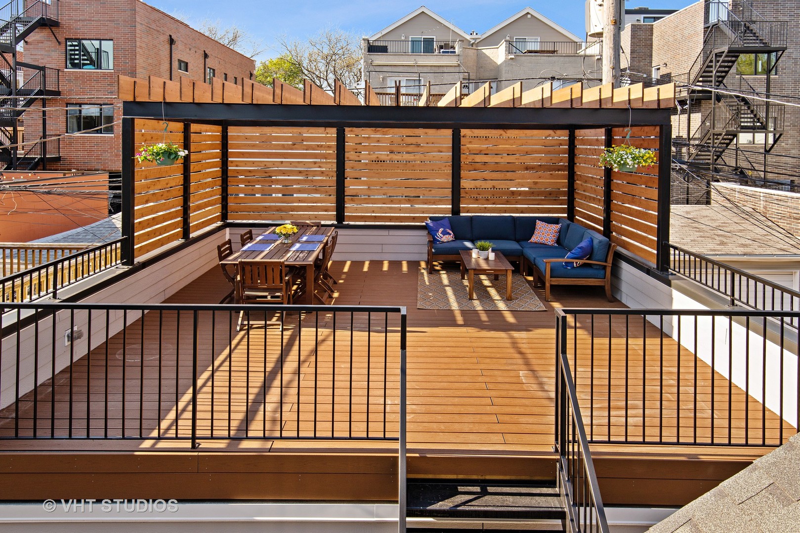 1734 West Henderson Street Chicago, IL 60657 - Photo 24 of 24 a view of a balcony with chairs and wooden floor