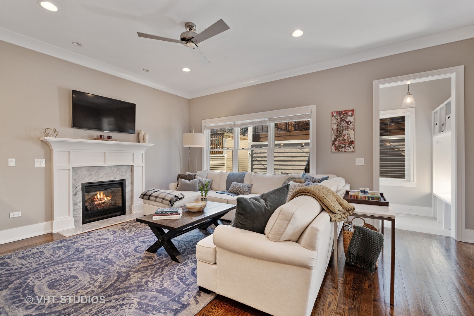 1734 West Henderson Street Chicago, IL 60657 - Photo 8 of 24 a living room with furniture fireplace and flat screen tv