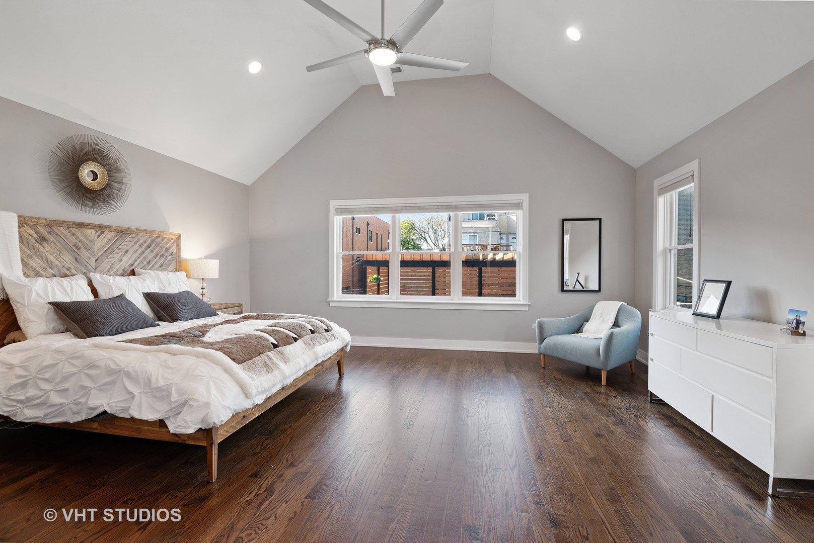 1734 West Henderson Street Chicago, IL 60657 - Photo 9 of 24 a bedroom with a bed and wooden floor