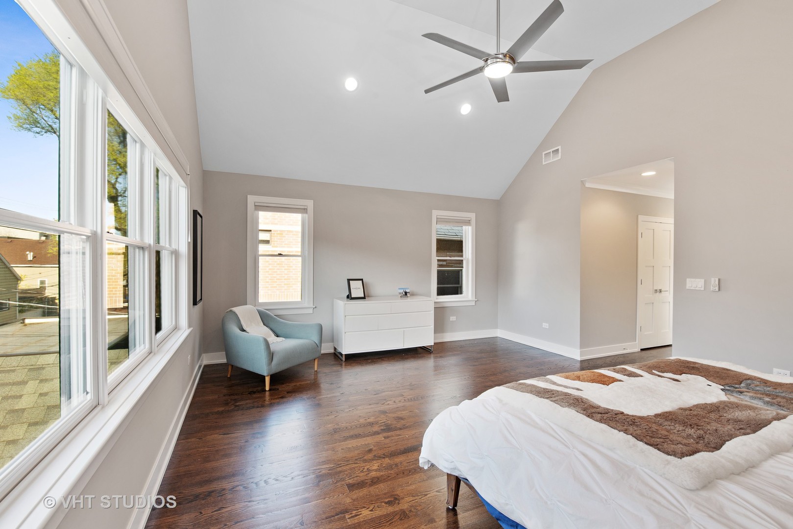 1734 West Henderson Street Chicago, IL 60657 - Photo 10 of 24 a bedroom with a bed and wooden floor