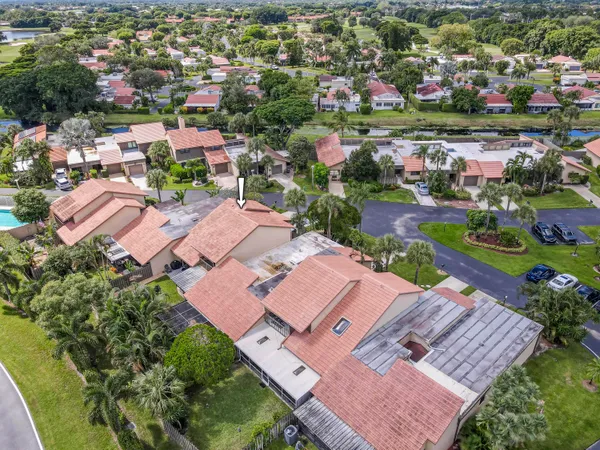 an aerial view of house with yard
