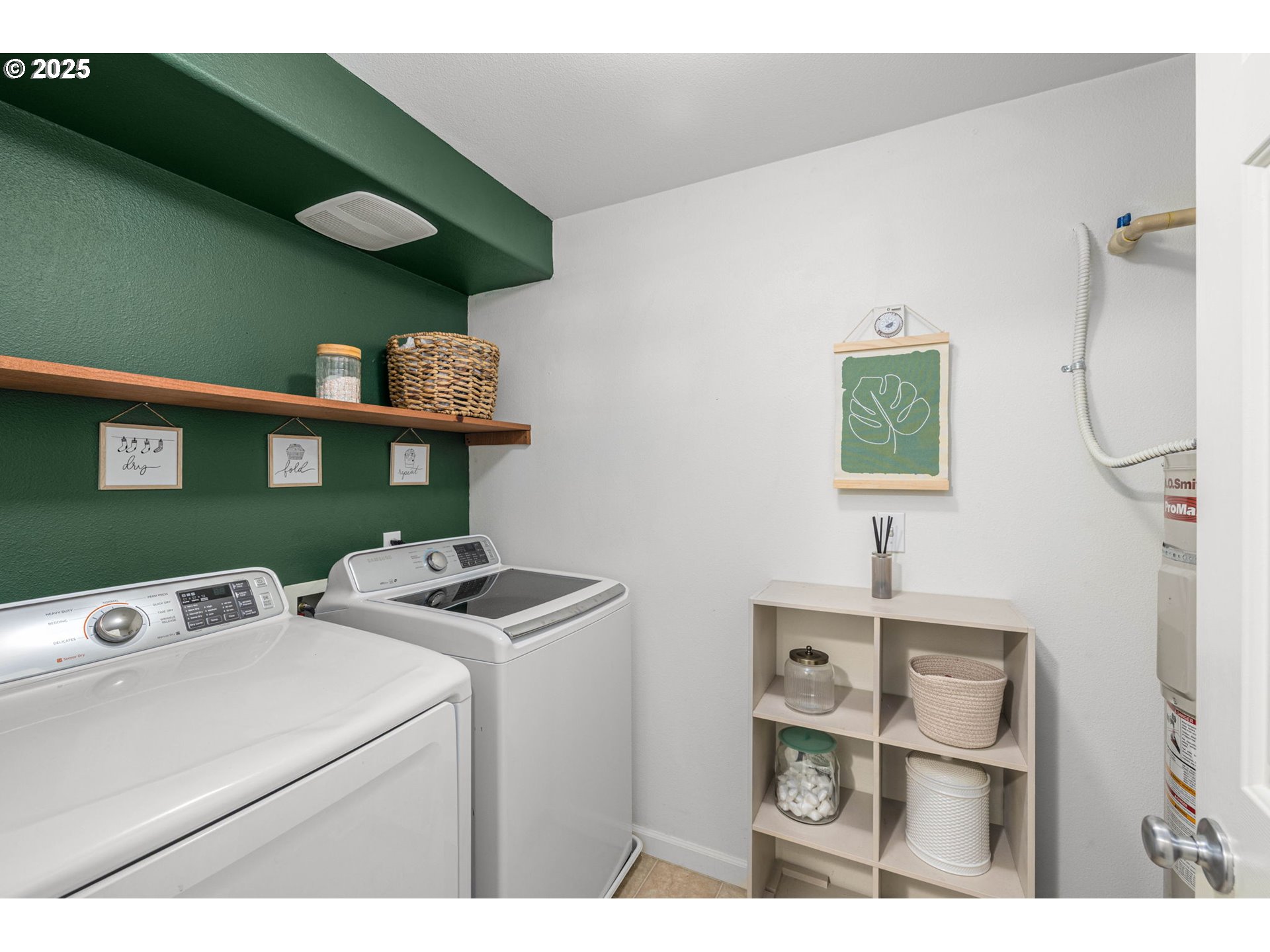 780 Northwest 185th Avenue, Unit 207 Beaverton, OR 97006 - Photo 26 of 29 a utility room with dryer washer and a fridge