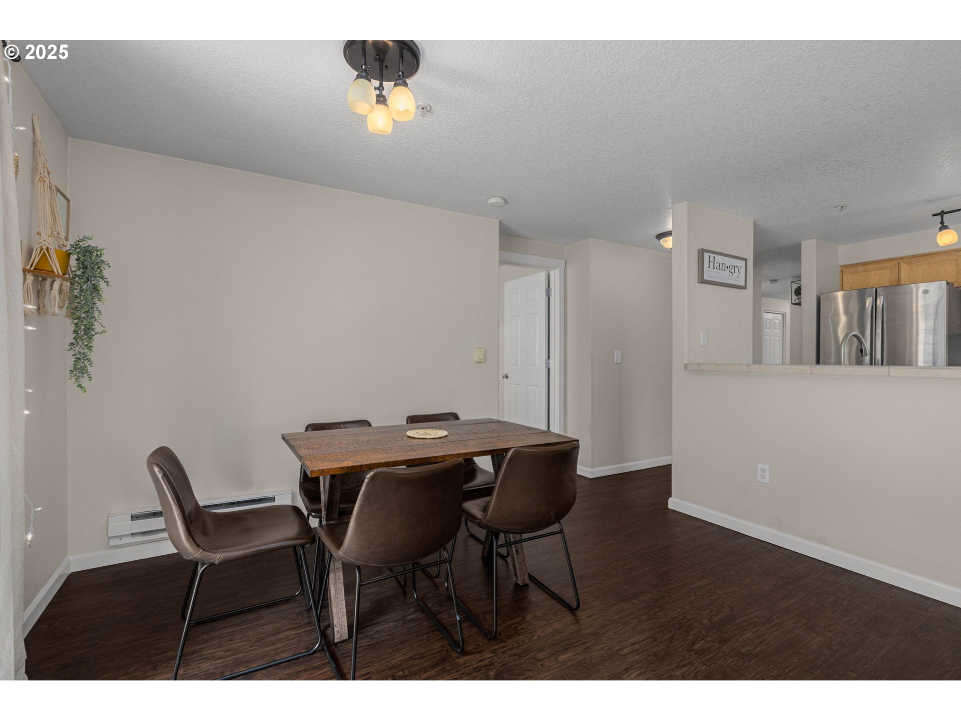 780 Northwest 185th Avenue, Unit 207 Beaverton, OR 97006 - Photo 9 of 29 a view of a dining room with furniture and wooden floor