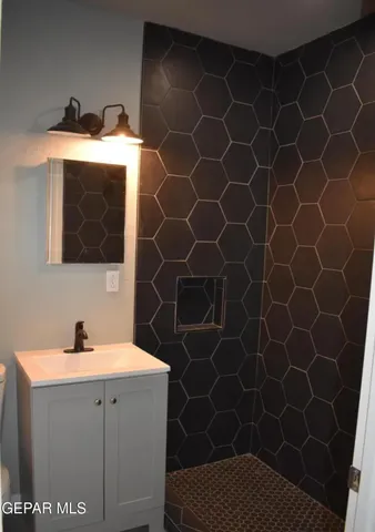 a bathroom with a sink and a mirror