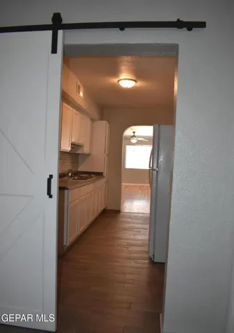 a kitchen with a sink and cabinets