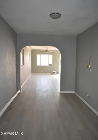 an empty room with a bathroom and a vanity