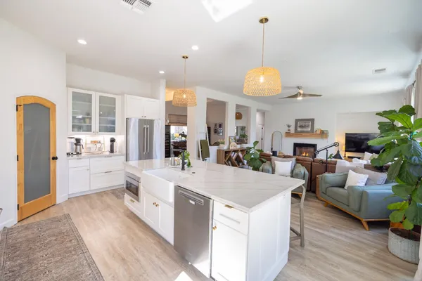 a bathroom with a granite countertop sink mirror and vanity