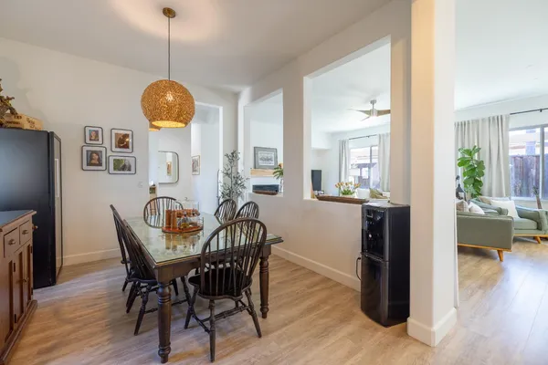 a bedroom with a bed and a mirror with a bookshelf