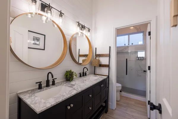 a hallway with sliding door and wooden floor