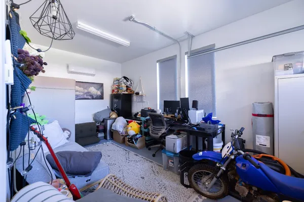 a bed room with a bed and a couch