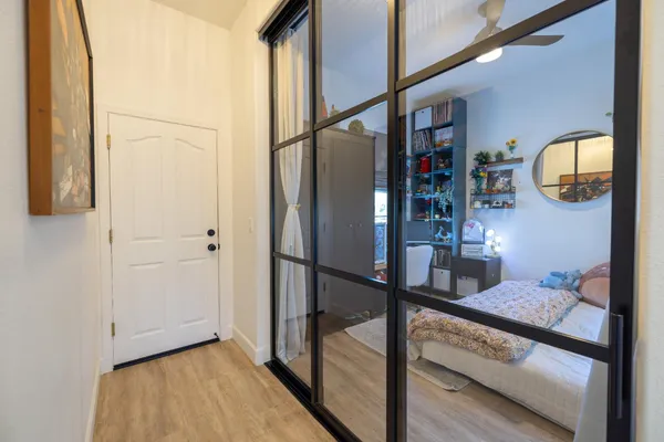 a spacious bedroom with a bed and a couch