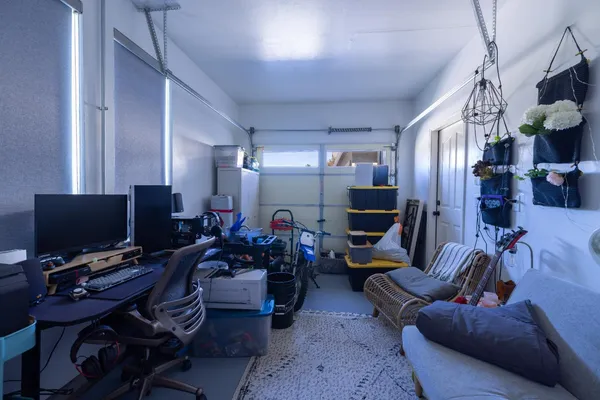 a bedroom with a bed and flat screen tv