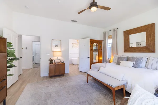 a view of a patio with table and chairs and potted plants