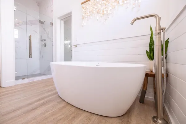 a view of a house with backyard porch and sitting area