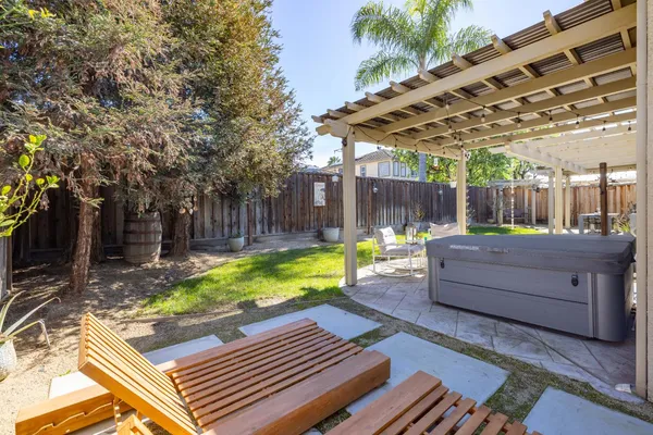 an aerial view of a house with balcony and garden