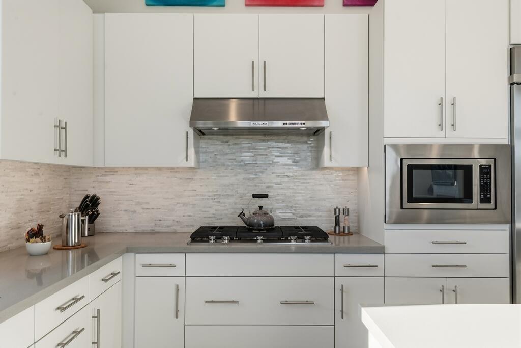 1200 Celadon Street Palm Springs, CA 92262 - Photo 11 of 47 a kitchen with a sink and cabinets