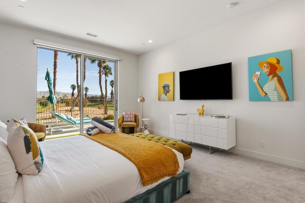 1200 Celadon Street Palm Springs, CA 92262 - Photo 14 of 47 a bedroom with a bed and a flat screen tv