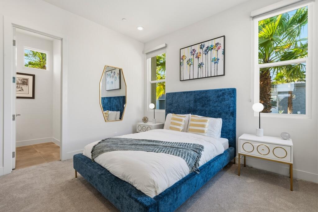 1200 Celadon Street Palm Springs, CA 92262 - Photo 17 of 47 a bedroom with a bed and a painting on the wall