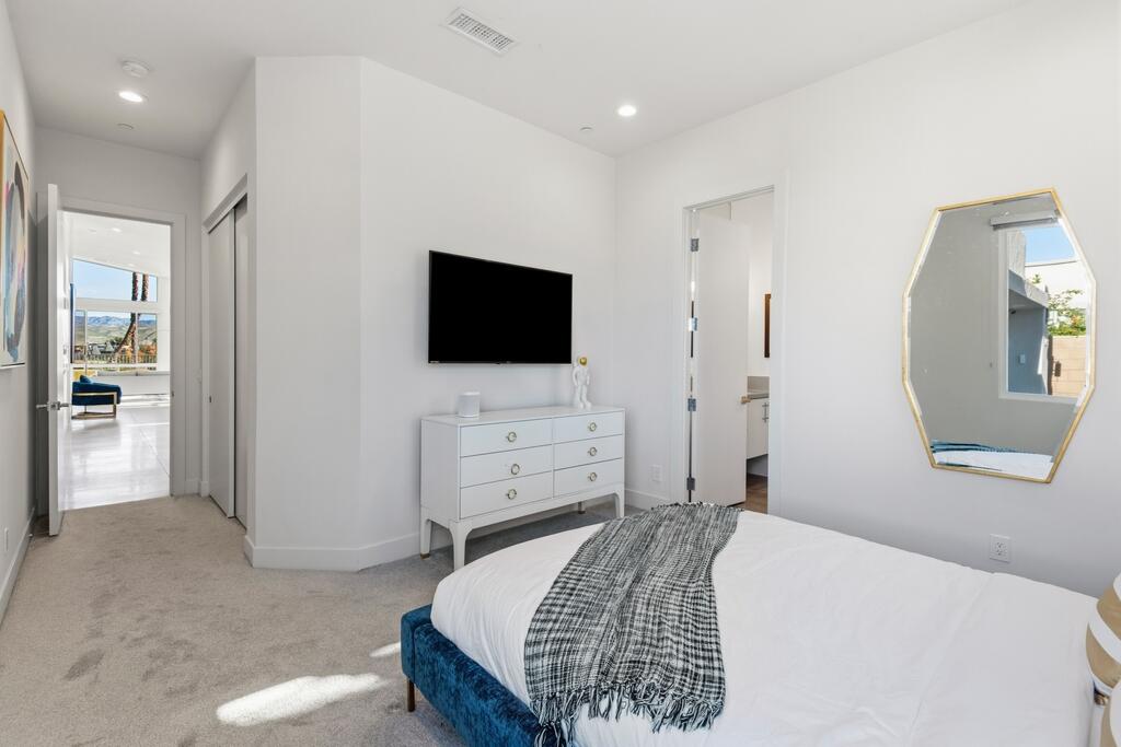 1200 Celadon Street Palm Springs, CA 92262 - Photo 18 of 47 a bedroom with a bed and a flat screen tv