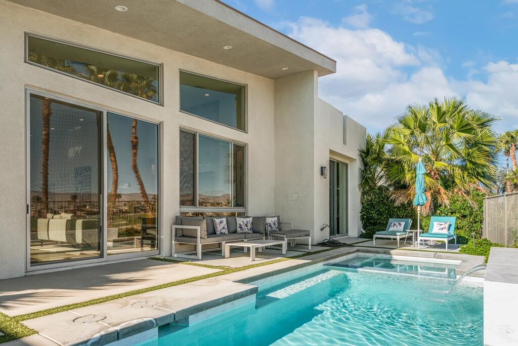 1200 Celadon Street Palm Springs, CA 92262 - Photo 2 of 47 a view of a house with swimming pool and sitting area