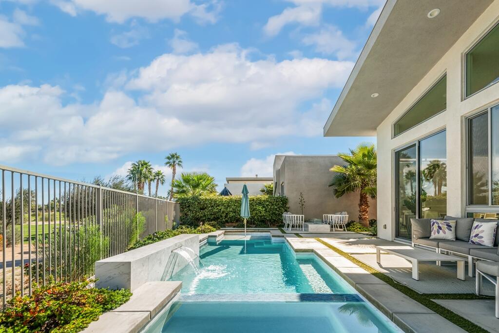 1200 Celadon Street Palm Springs, CA 92262 - Photo 25 of 47 a view of a patio with couches table and chairs and potted plants