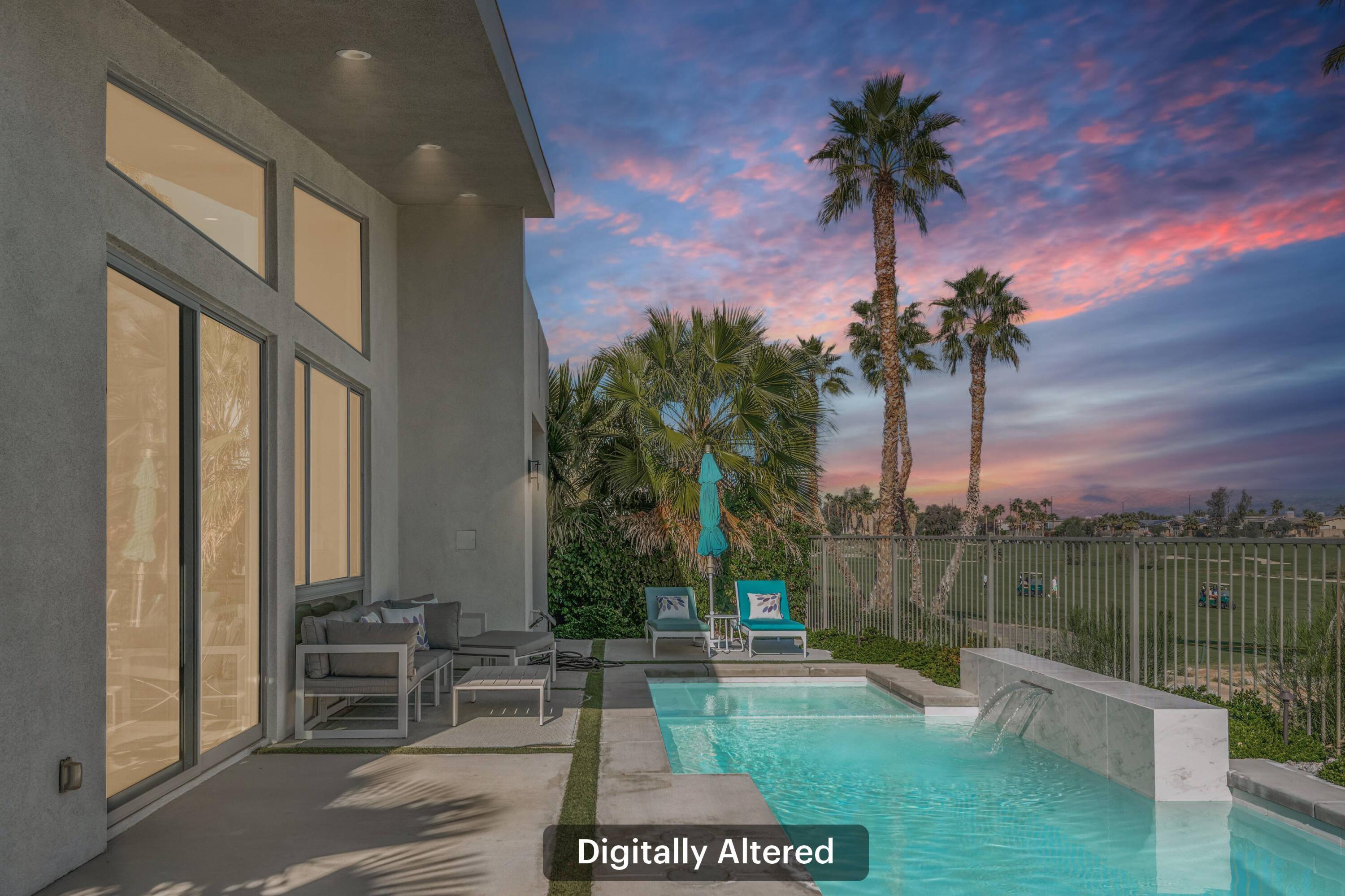 1200 Celadon Street Palm Springs, CA 92262 - Photo 28 of 47 a view of a patio with couches and a table and chairs with wooden floor and fence