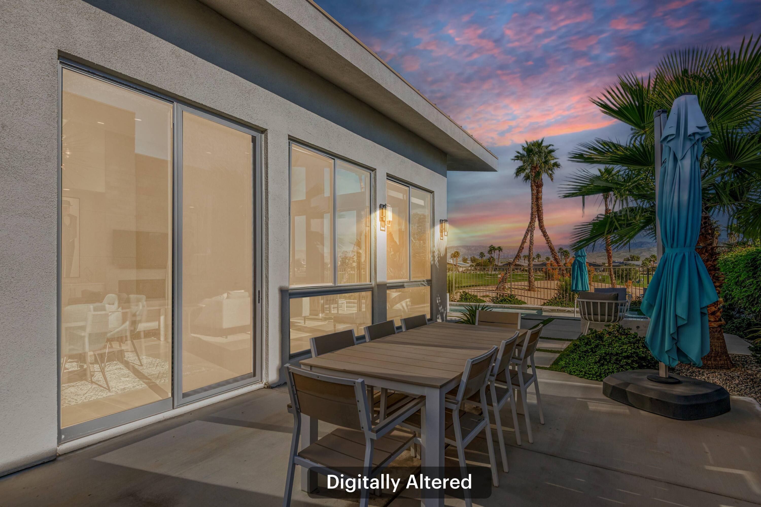 1200 Celadon Street Palm Springs, CA 92262 - Photo 32 of 47 a patio with table and chairs and potted plants