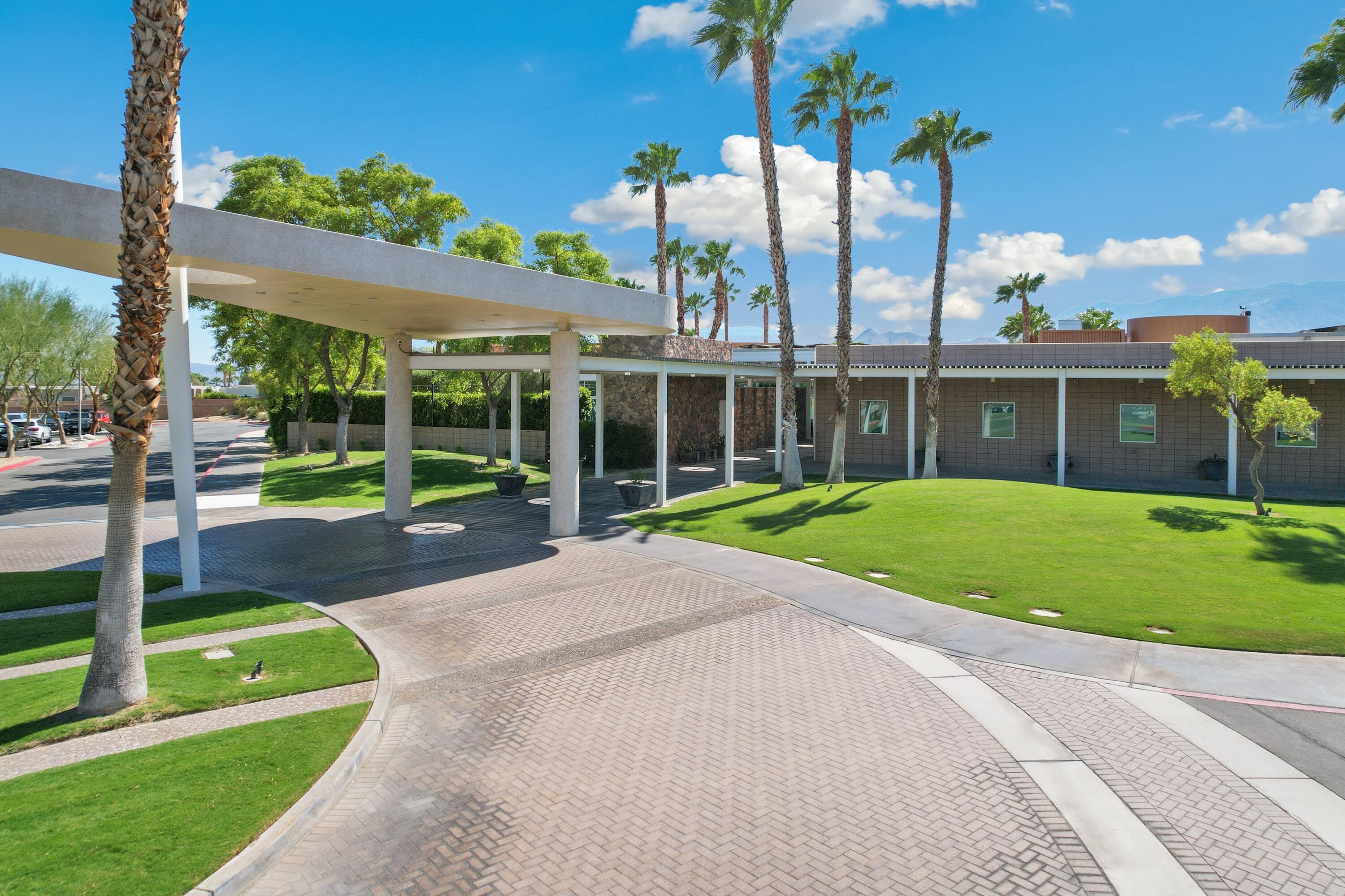 1200 Celadon Street Palm Springs, CA 92262 - Photo 47 of 47 a view of a house with a big yard and palm trees