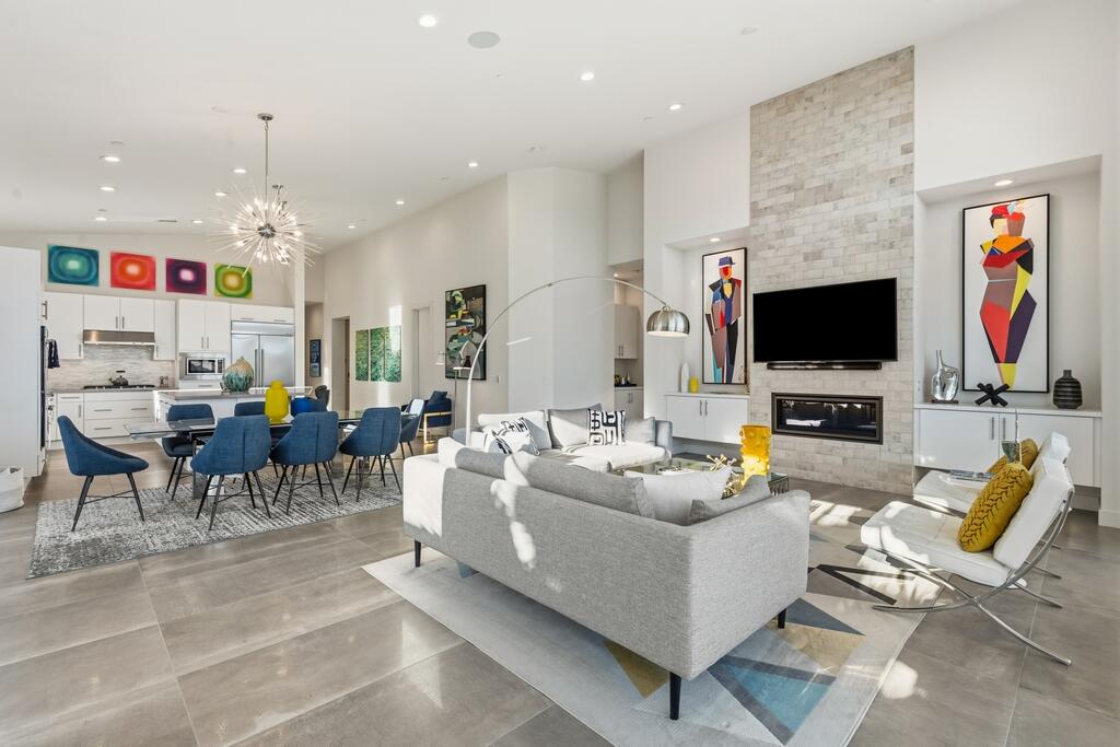 1200 Celadon Street Palm Springs, CA 92262 - Photo 6 of 47 a living room with furniture a flat screen tv and a chandelier