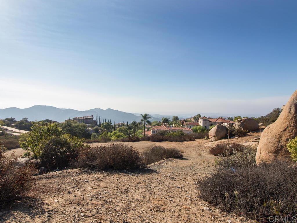 9782 Crystal Ridge Drive Escondido, CA 92026 - Photo 25 of 31 a view of a dry field with mountains in the background