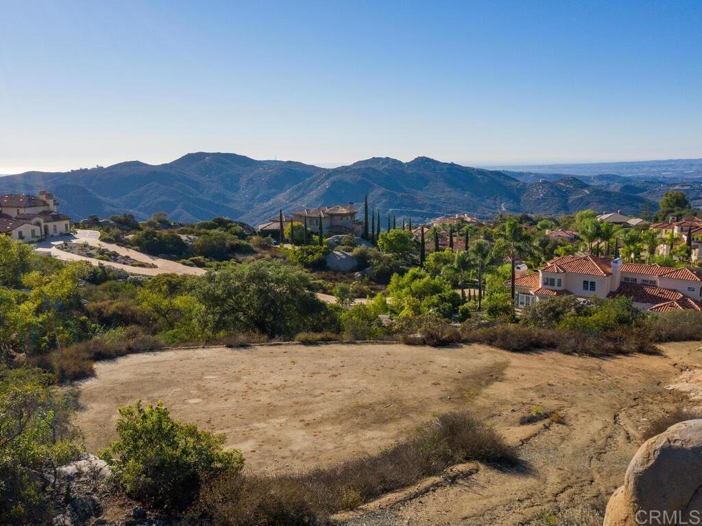 9782 Crystal Ridge Drive Escondido, CA 92026 - Photo 27 of 31 a view of a lush green field with mountains in the background