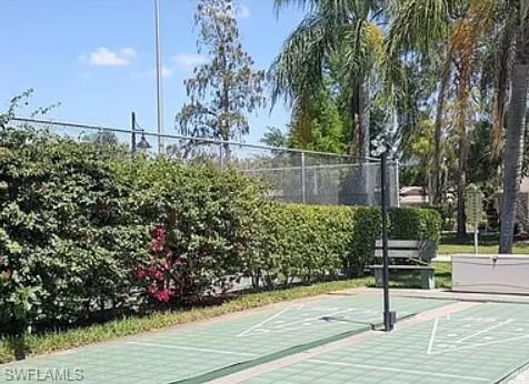 175 Turtle Lake Court, Unit 111 Naples, FL 34105 - Photo 17 of 19 a view of a bench in a backyard