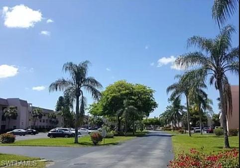 175 Turtle Lake Court, Unit 111 Naples, FL 34105 - Photo 18 of 19 a view of a park with palm trees