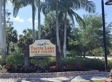 175 Turtle Lake Court, Unit 111 Naples, FL 34105 - Photo 19 of 19 a sign on the side of a road