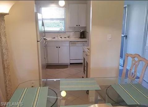 175 Turtle Lake Court, Unit 111 Naples, FL 34105 - Photo 9 of 19 a room with cabinets and a fireplace