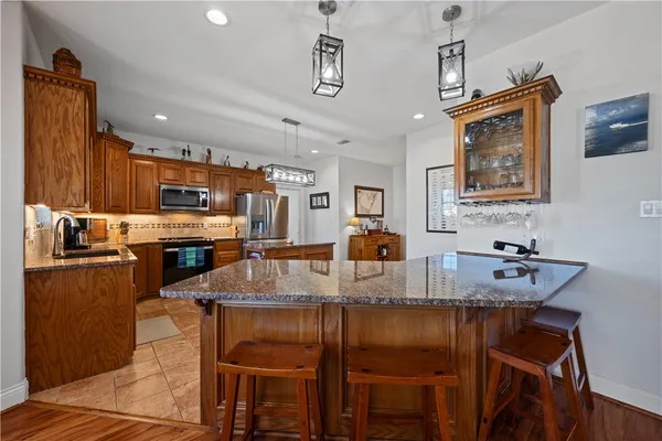 a kitchen with refrigerator and cabinets