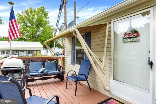 a view of entryway with wooden floor and door