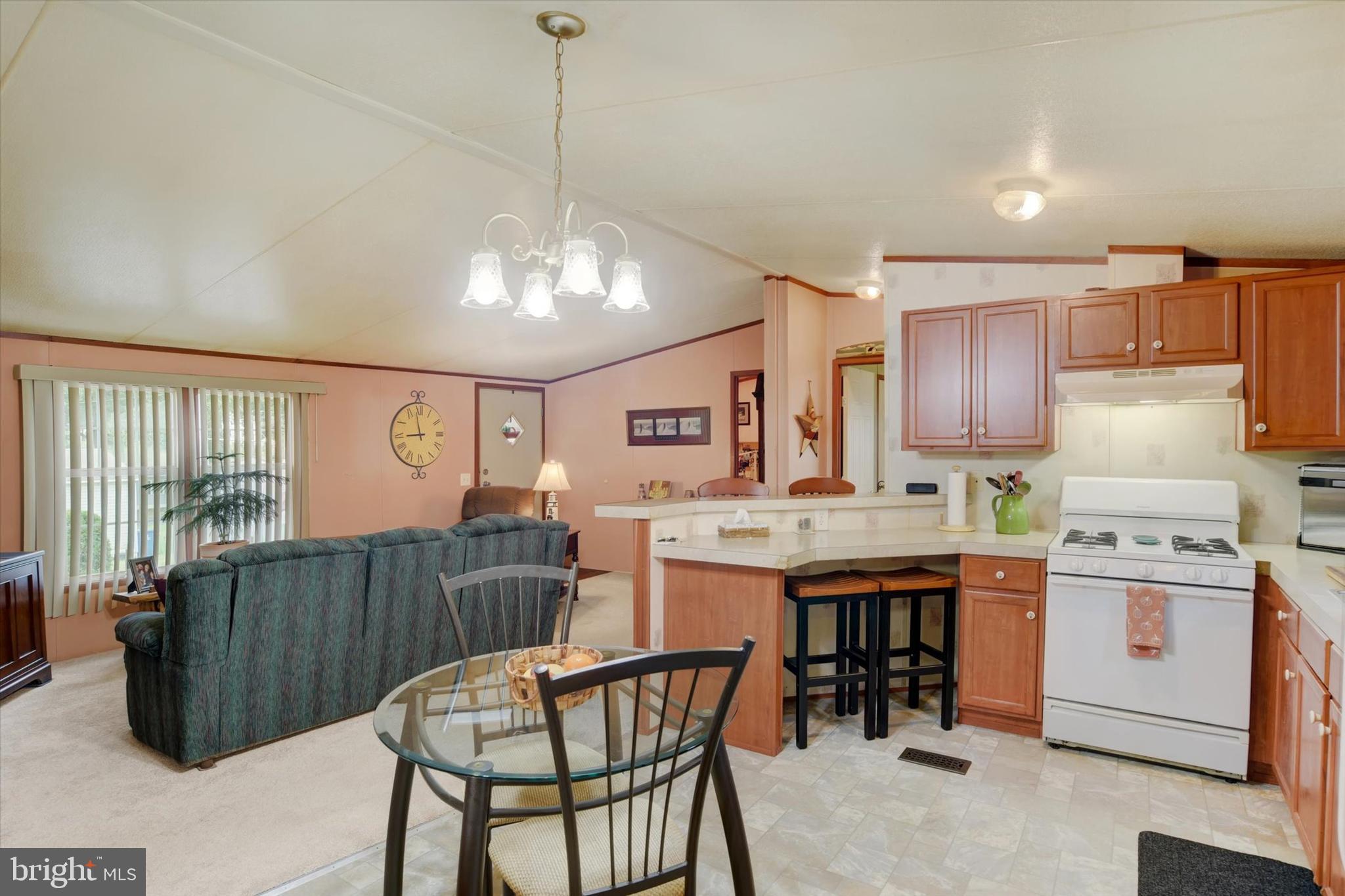1 Rovak Drive Middletown, PA 17057 - Photo 4 of 18 a kitchen with a stove a refrigerator and a table