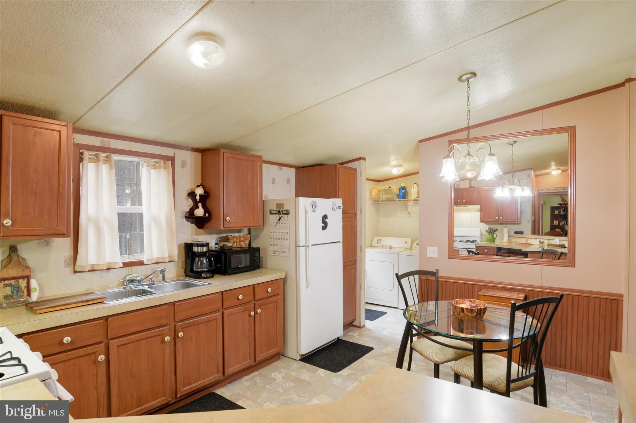 1 Rovak Drive Middletown, PA 17057 - Photo 6 of 18 a kitchen with stainless steel appliances kitchen island granite countertop a dining table chairs and granite counter tops