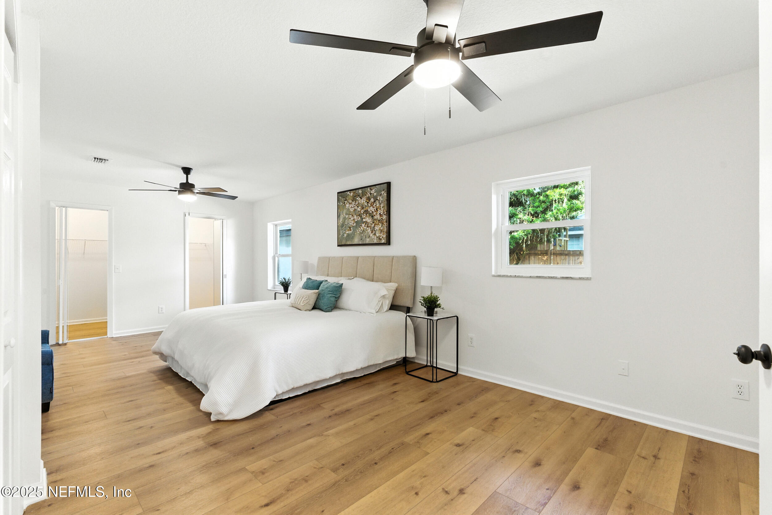 160 Linden Road St. Augustine, FL 32086 - Photo 15 of 48 a bedroom with a bed chandelier and a window